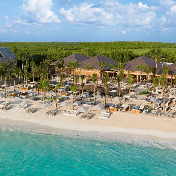beach club cabanas line white-san beach on caribbean ocean